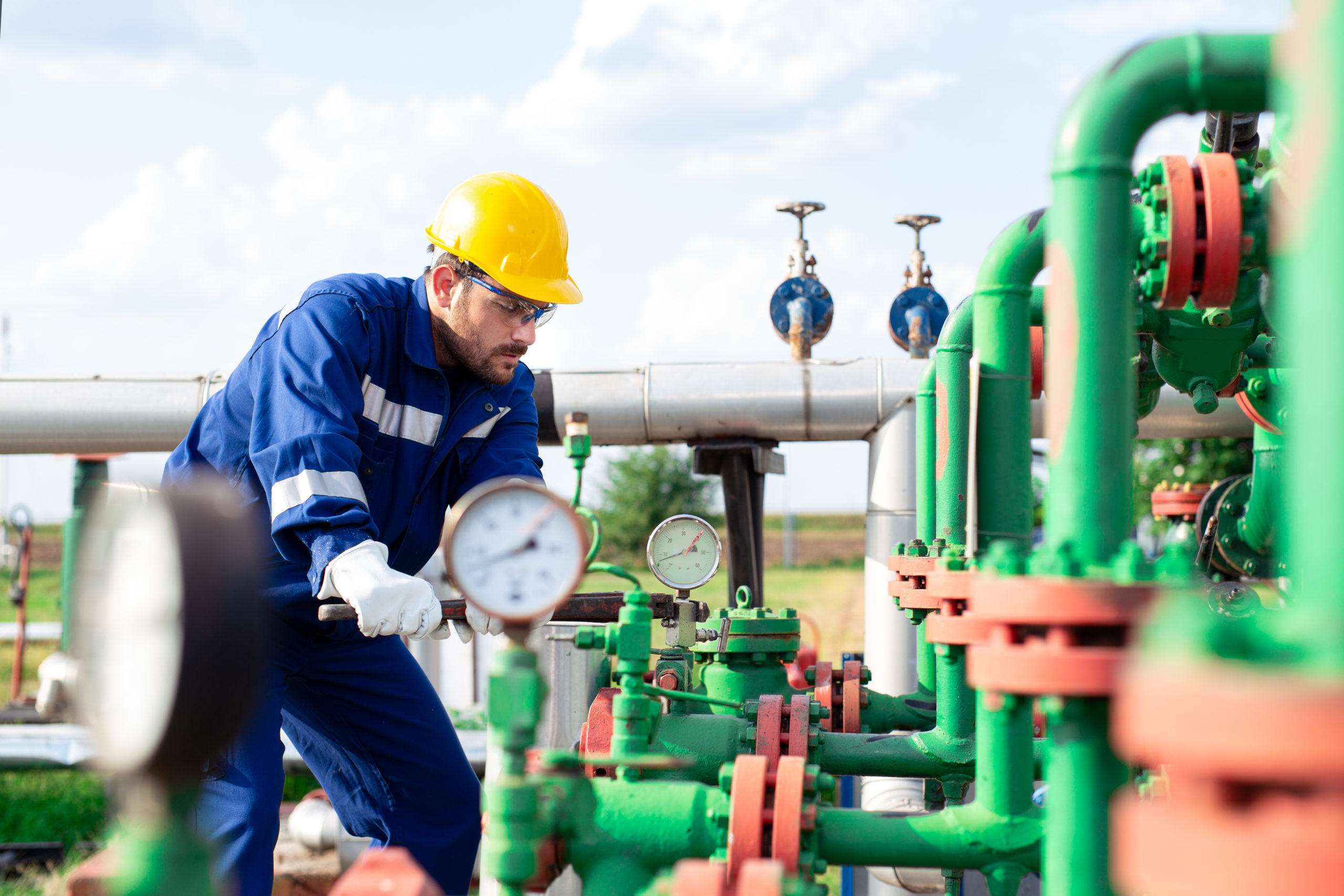 Oil worker is checking the oil pump Oil worker is checking the oil pump